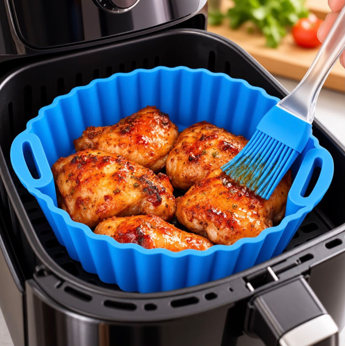 Blue silicone basket used in an air fryer for chicken
