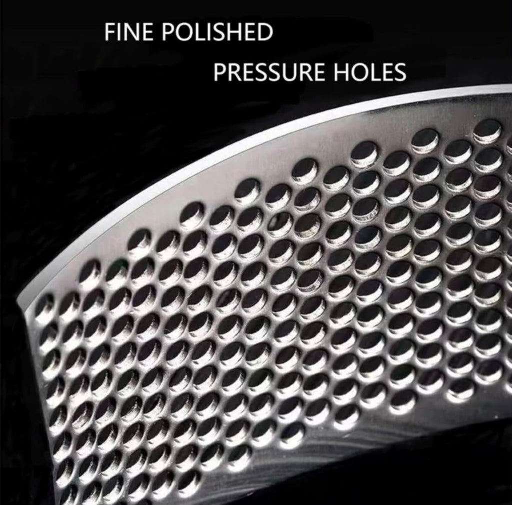 Close-up of stainless steel garlic press pressing holes
