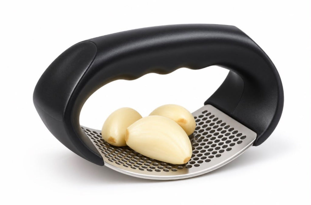 Stainless steel garlic press with garlic cloves