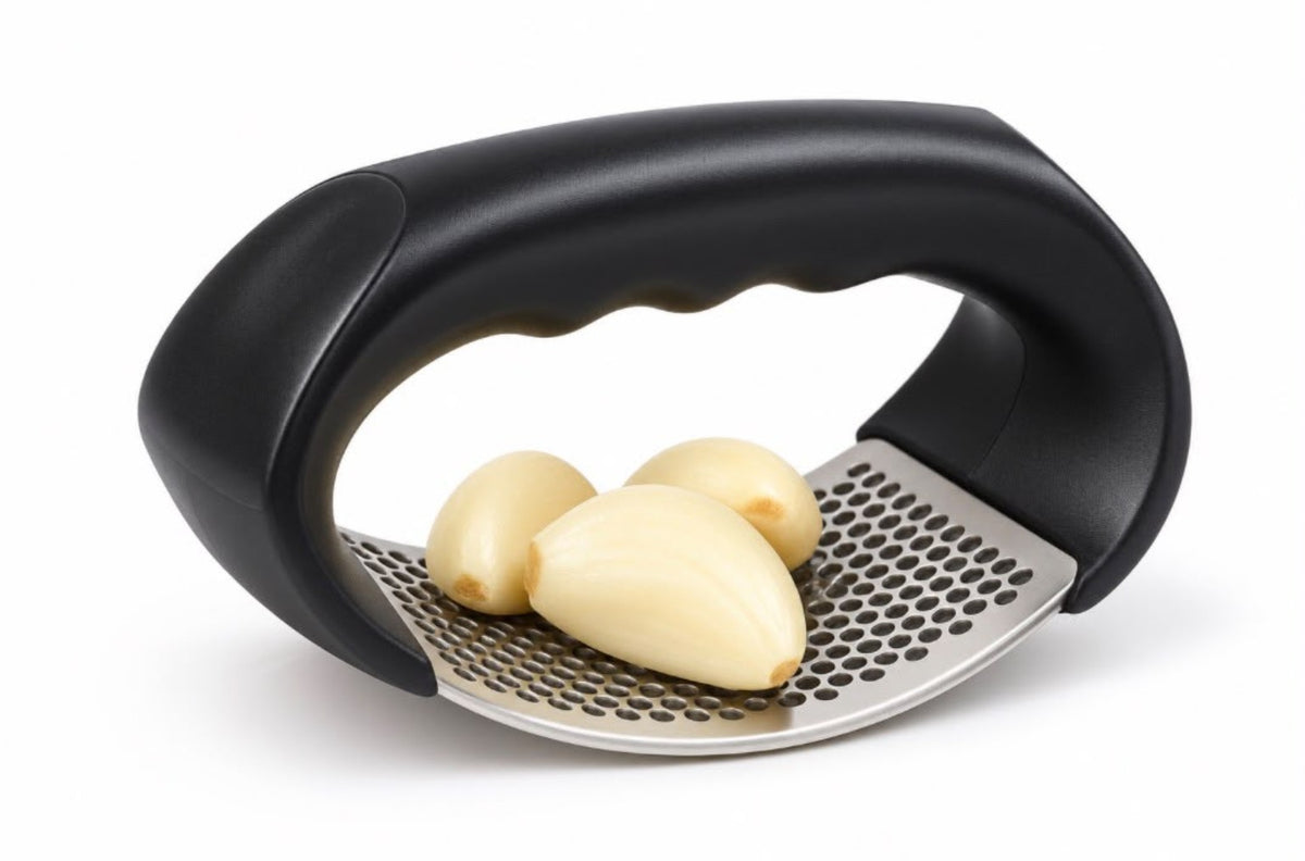 Stainless steel garlic press with garlic cloves
